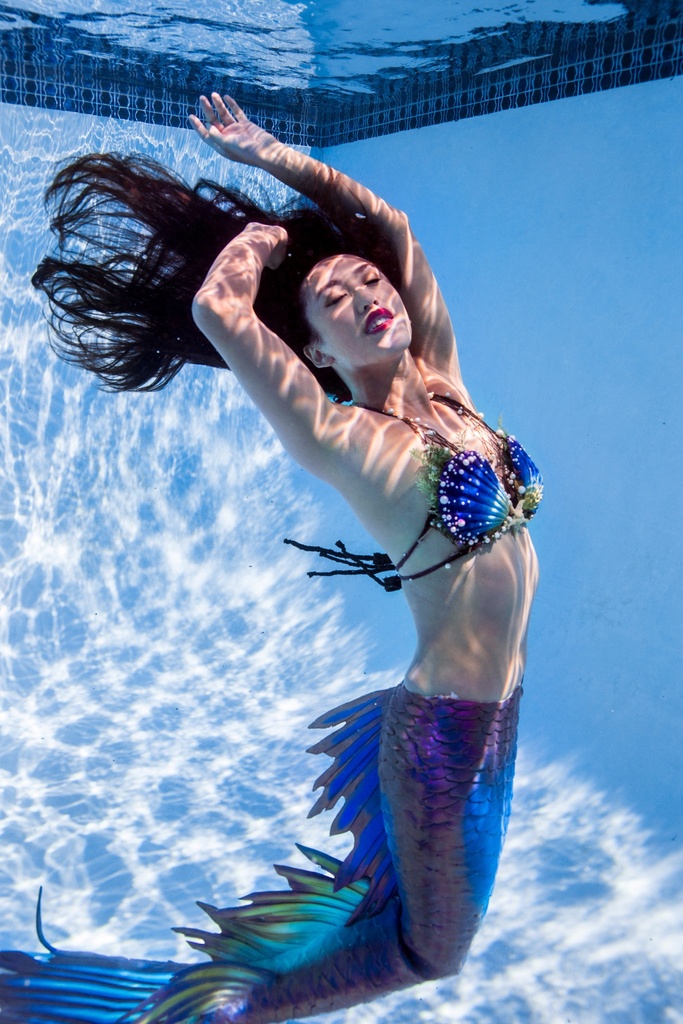 Mermaid Alisa in a local swimming pool, California, USA, 2019